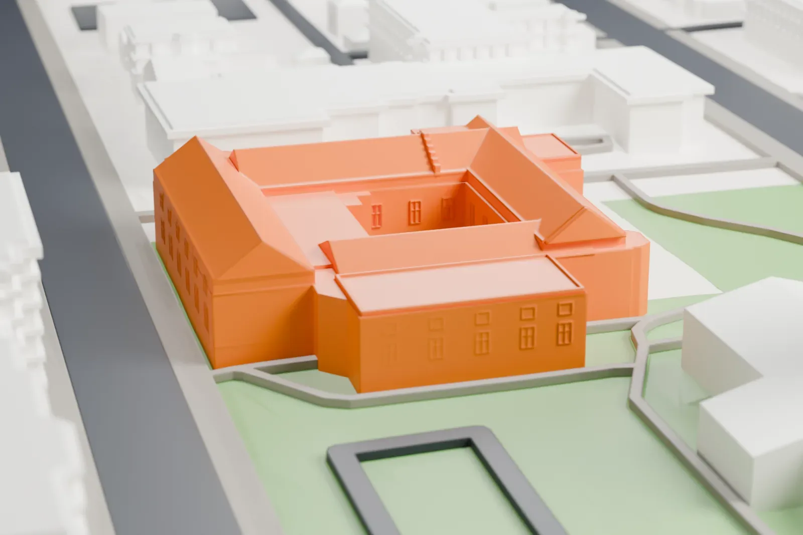 A white 3D print of the Institute for the Study of Ancient Cultures among the surrounding streets and buildings.