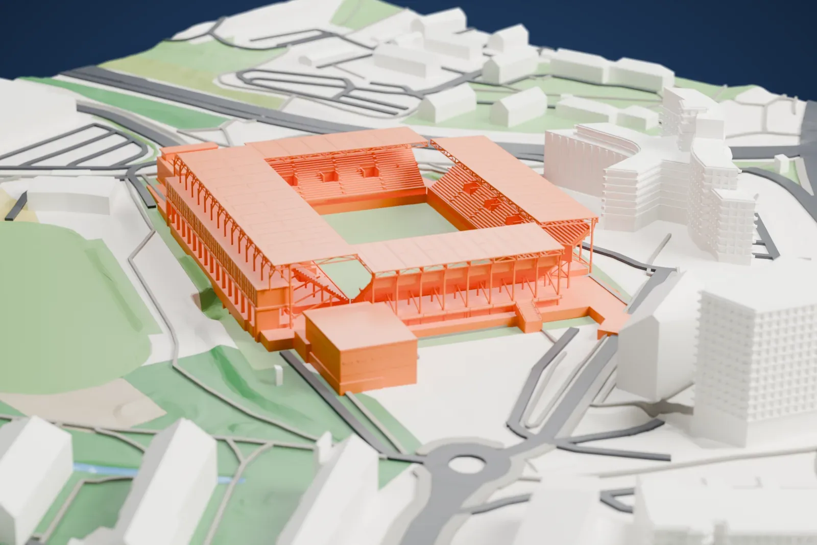 A white 3D print of the Intility Arena, four thin roof canopies around an open rectangular bowl, set in the surrounding city.