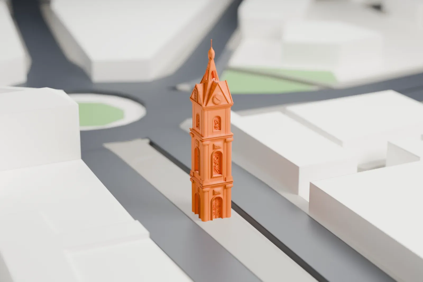 A white 3D print of the Jaffa Clock Tower, a slender stone tower with a gabled clock crown, among the surrounding streets and buildings.