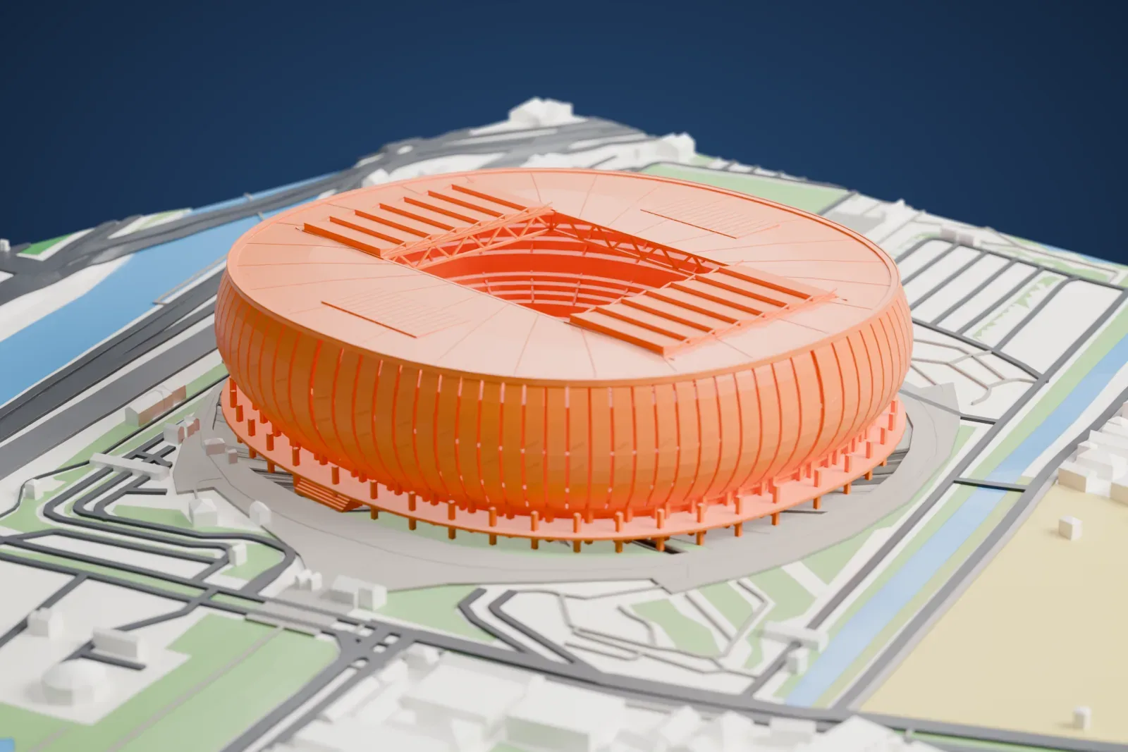 A white 3D print of Jakarta International Stadium, its rounded striped shell and open roof rising among surrounding city buildings.