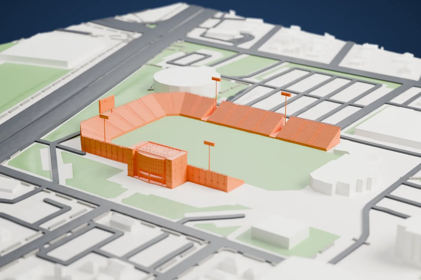 A white 3D print of James M. Shuart Stadium, a horseshoe of stands around a grass field with tall floodlight masts, beside a round building and city streets.