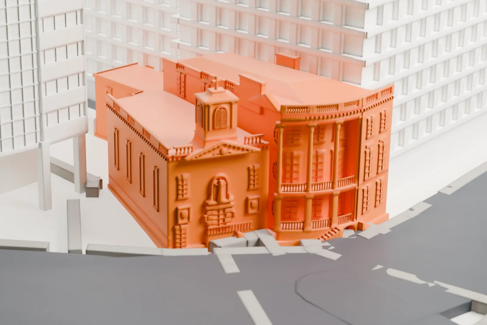 A white 3D print of the James Watson House, a building with a small bell tower and a curved columned front, standing beside a large round-fronted building and a wide street.