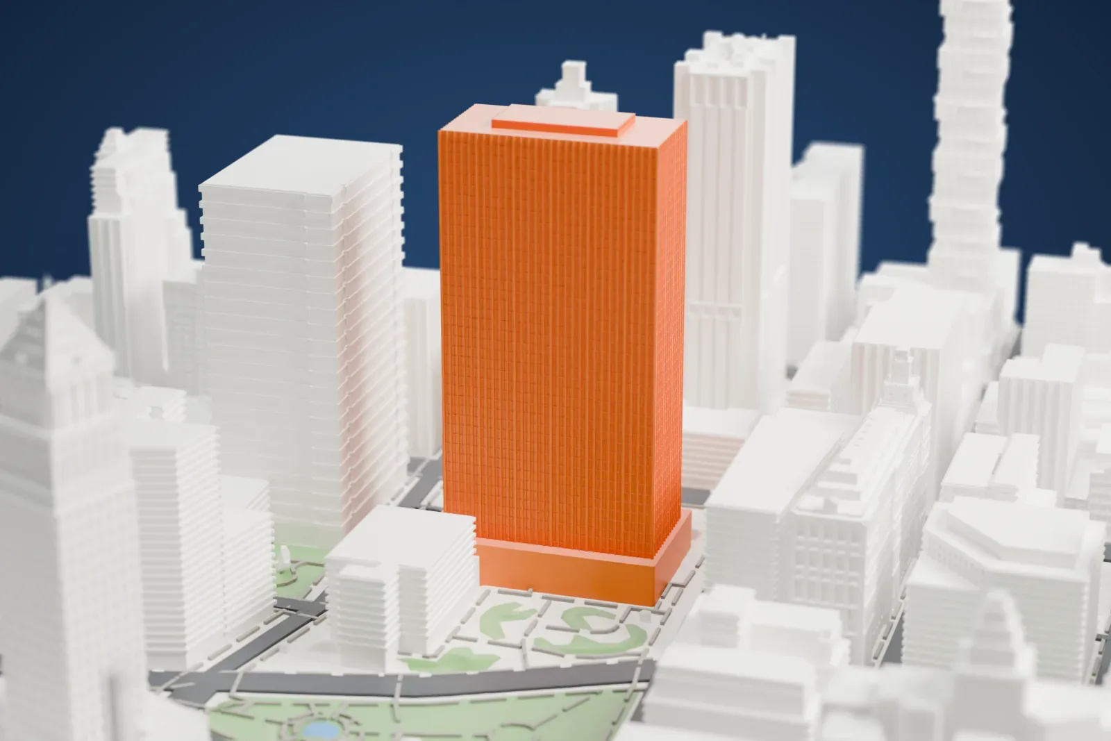 A white 3D print of the Javits Federal Building, a rectangular tower with a gridded facade and raised rooftop block, among surrounding buildings, streets, and green spaces.