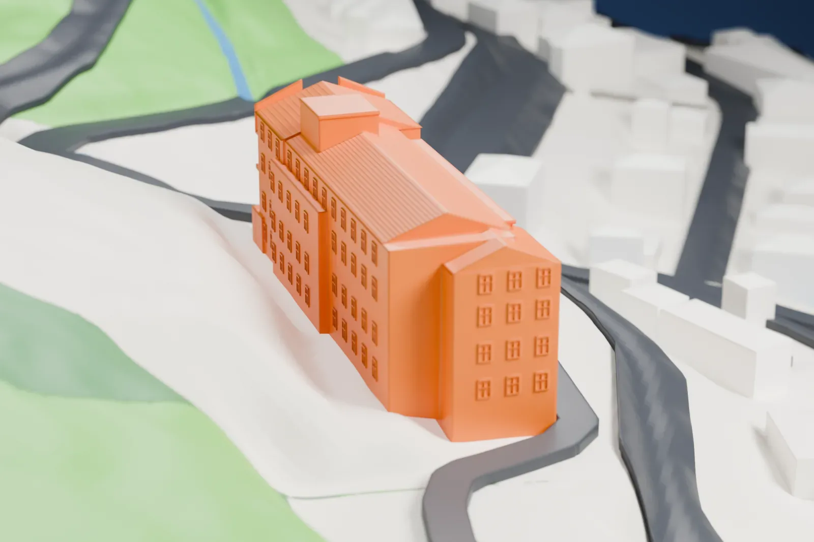 A white 3D print of the Jerome Grand Hotel, with sloping roofs and an arched porch, set among winding streets, nearby buildings, and steep terrain.