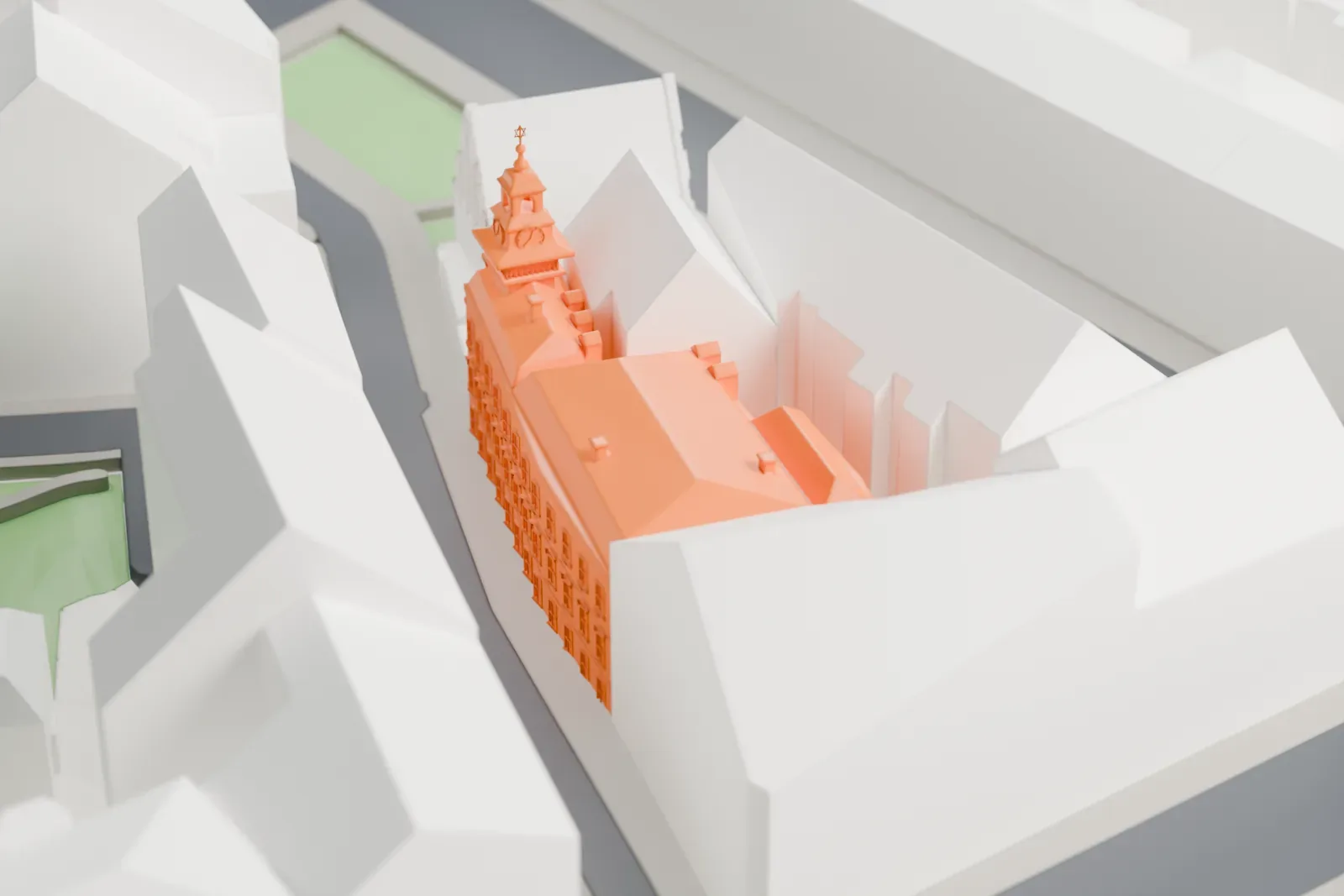 A white 3D print of the Jewish Town Hall in Prague, standing among the surrounding streets and buildings.