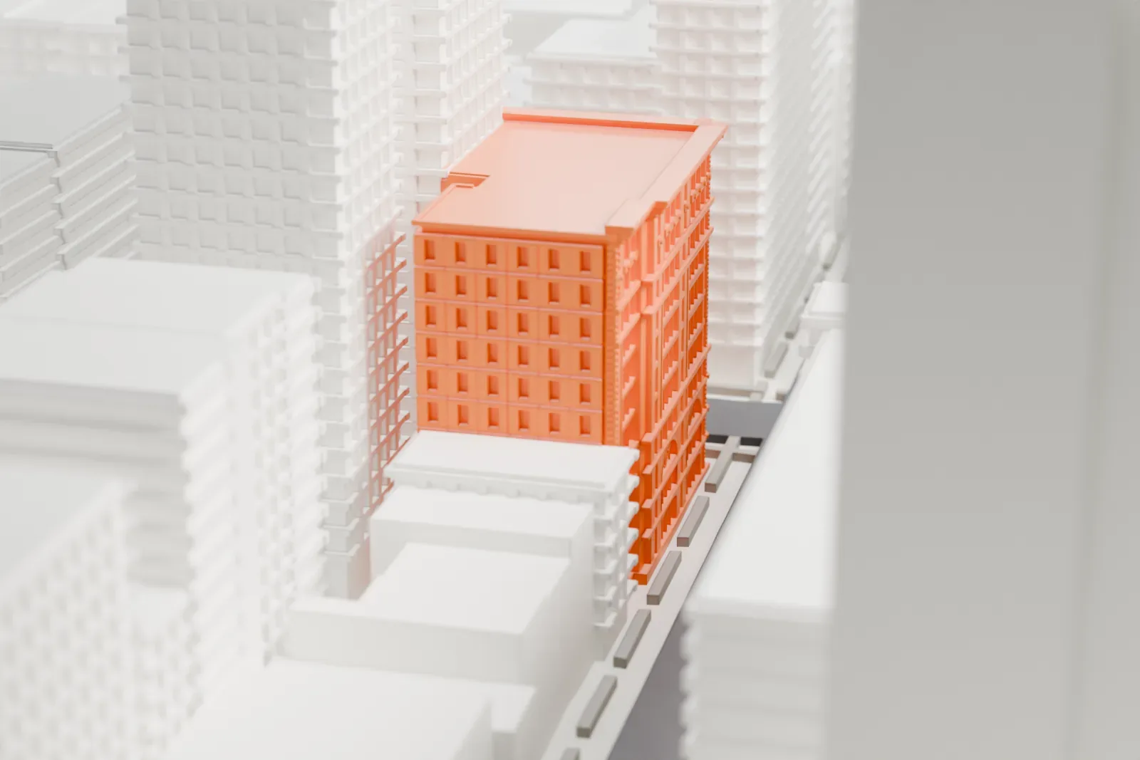 A white 3D print of the Judge Building, a narrow building with an ornate cornice and arched windows, wedged between taller neighboring towers.