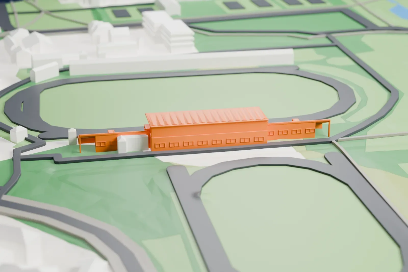 A white 3D print of the Kadriorg Stadium grandstand, a long stand with a broad flat roof, beside two oval tracks and nearby buildings.