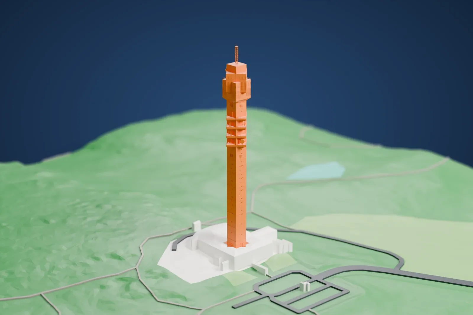 A white 3D print of Kaknästornet, a tall slim tower with stacked platforms, a boxy top and an antenna mast, on a green hillside with a few roads and low buildings at its base.