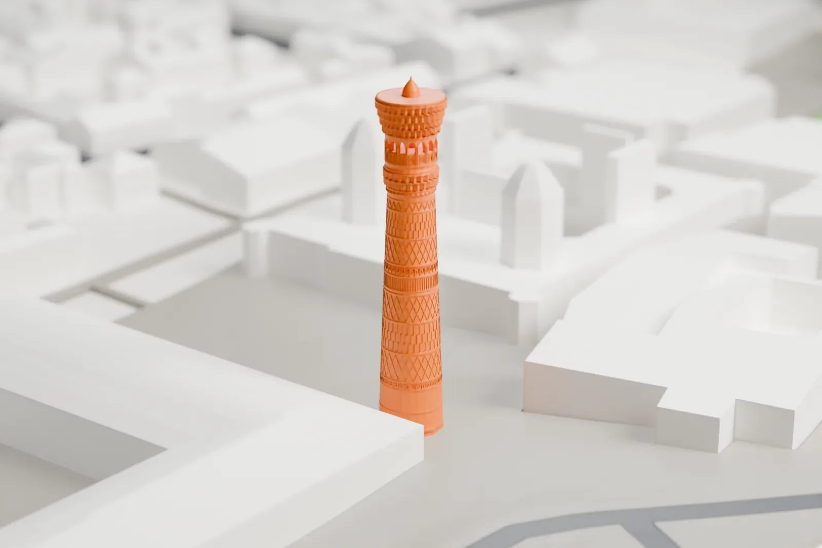 A white 3D print of the Kalyan Minaret, its tapered brick shaft rising to a flared crown above surrounding buildings.