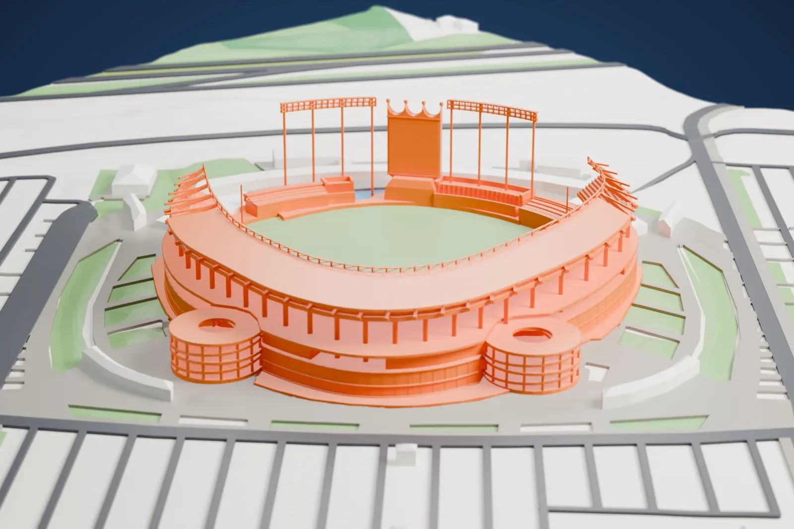 A white 3D print of Kauffman Stadium with its curved seating bowl, outfield fountain terraces and crown-shaped scoreboard, set among surrounding streets and buildings.