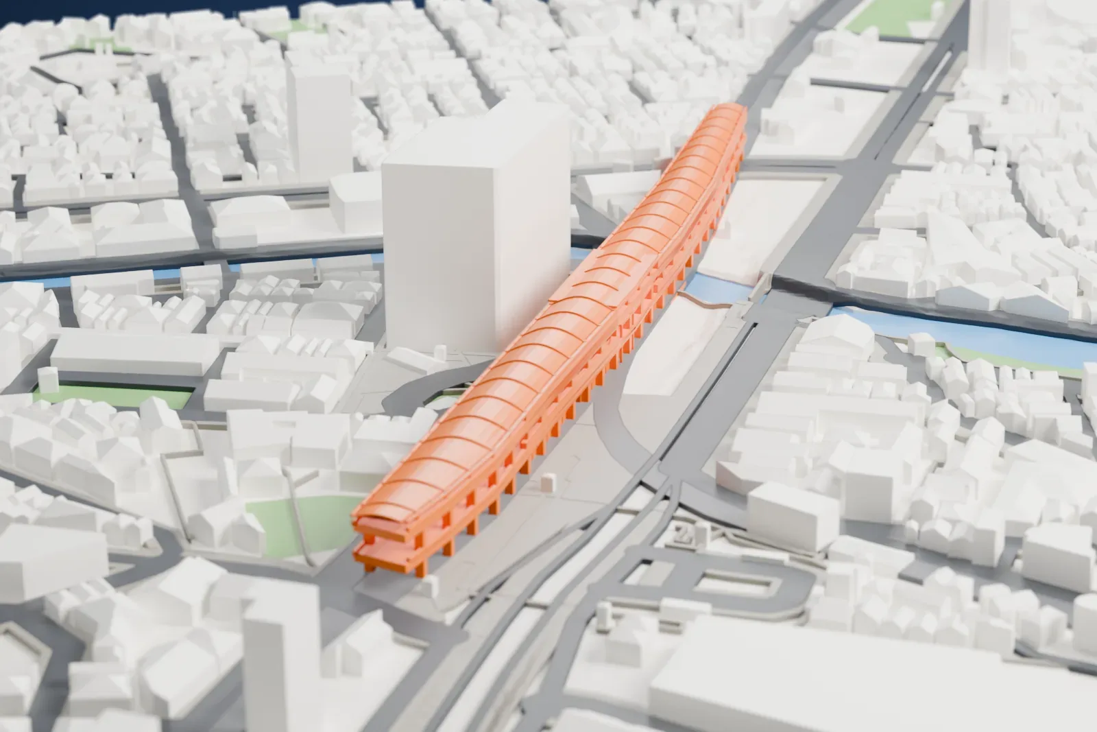A white 3D print of Keikyū Kamata Station, with its long elevated platforms and tracks, among the surrounding buildings of Tokyo.