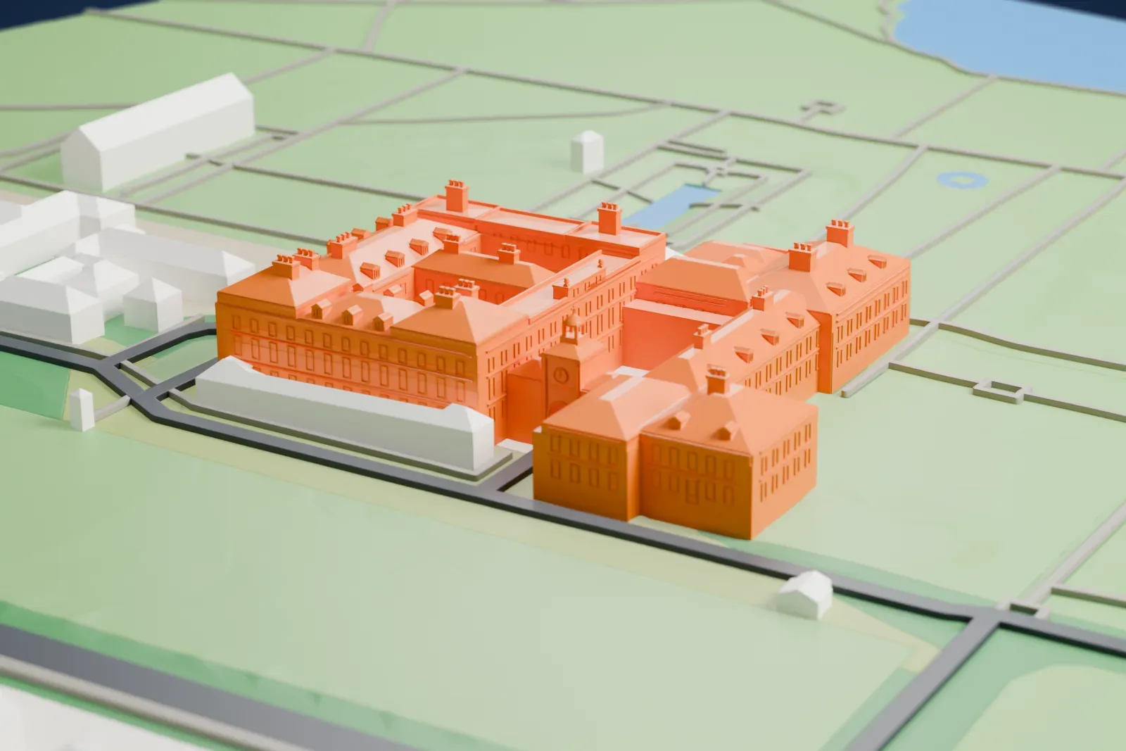 A white 3D print of Kensington Palace, its long facade and wings set among the surrounding gardens and streets.