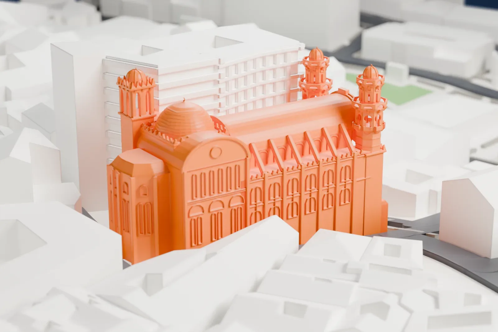 A white 3D print of Ketchaoua Mosque, a domed building with a long vaulted roof and two towers at the front, surrounded by densely packed buildings.