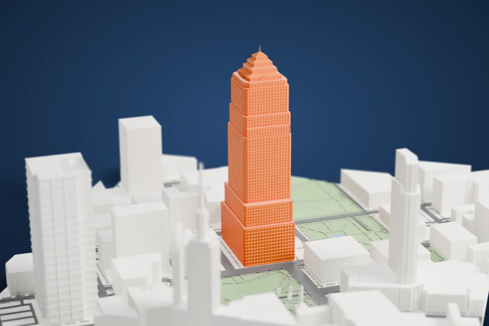 A white 3D print of Key Tower, a tall stepped skyscraper topped with a pyramid and thin spire, rising among the buildings and green squares of downtown Cleveland.