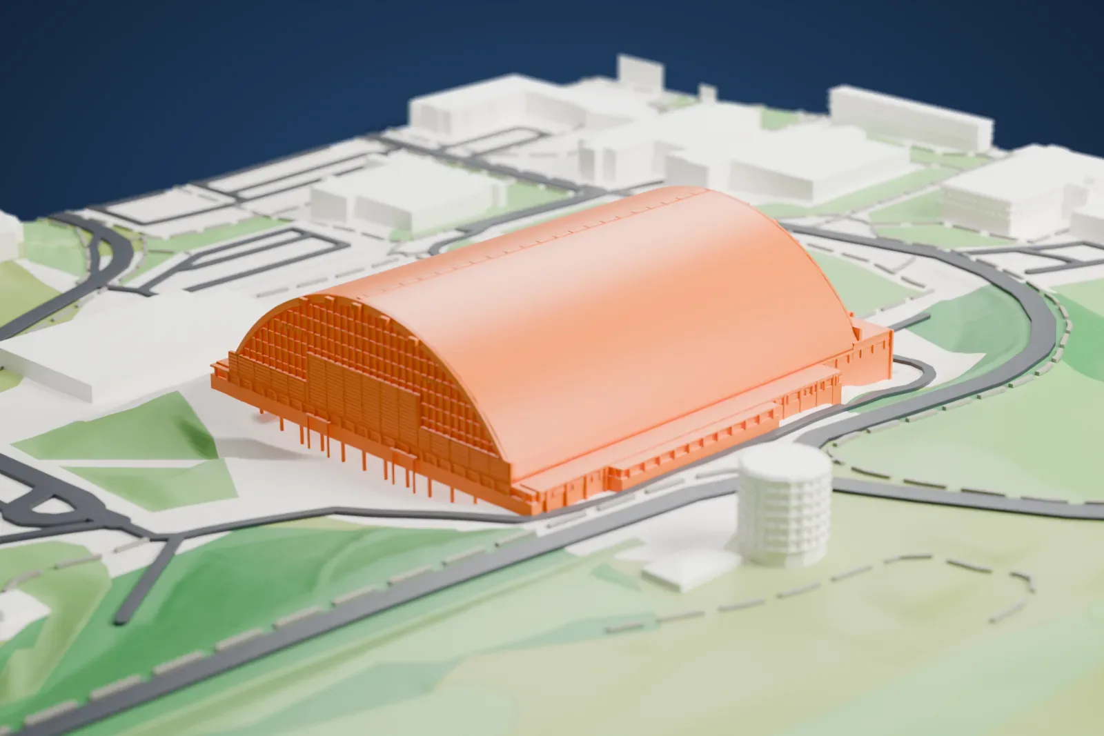 A white 3D print of the Kibbie Dome, a long building under a smooth barrel-arched roof with low buildings at its ends, set among roads, grass fields and green hillside.