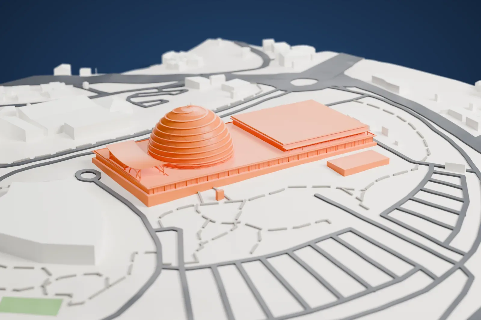 A white 3D print of the Kigali Convention Centre, a long low building with a large ribbed dome, among roads and roundabouts.