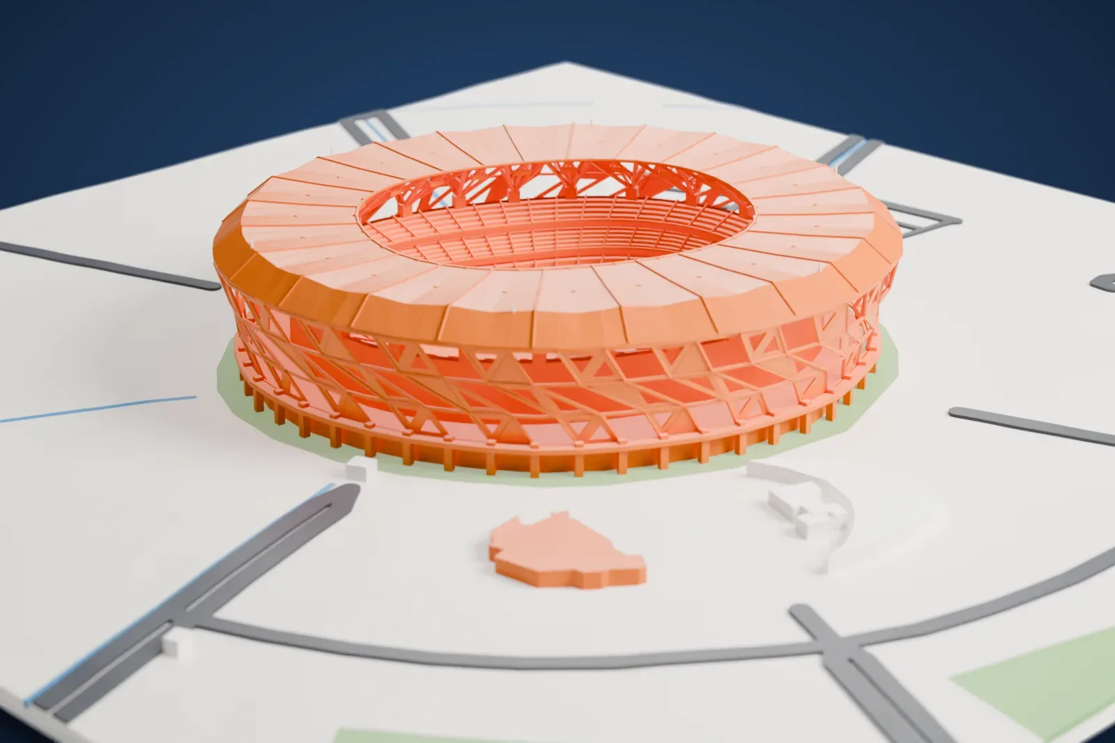 A white 3D print of King Abdullah Sports City Stadium, a round stadium with an open lattice wall and a ring roof, standing on flat open ground with a few roads and buildings nearby.
