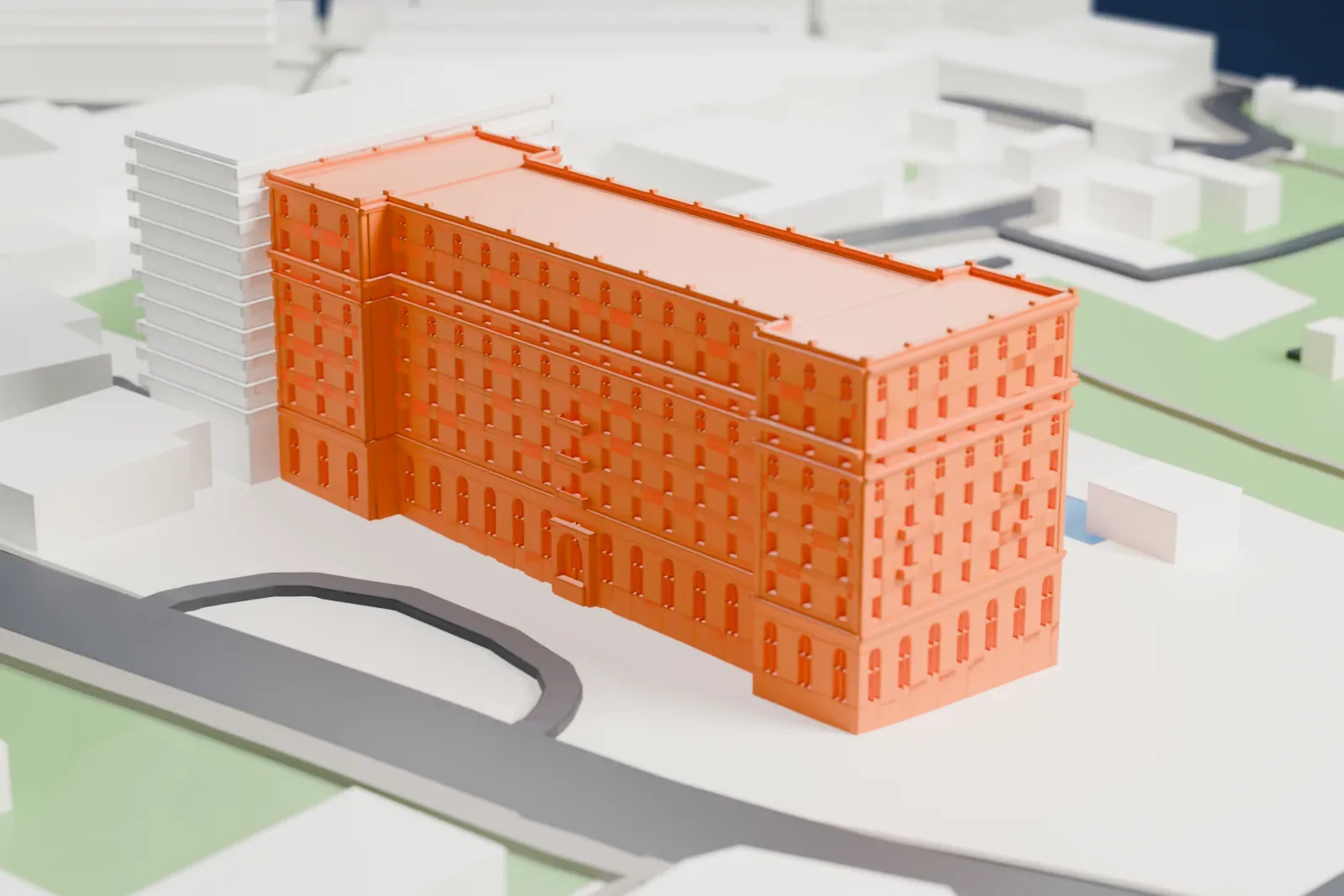A white 3D print of the King David Hotel, a long building with projecting end wings and a flat roof, among the surrounding streets and buildings of Jerusalem.