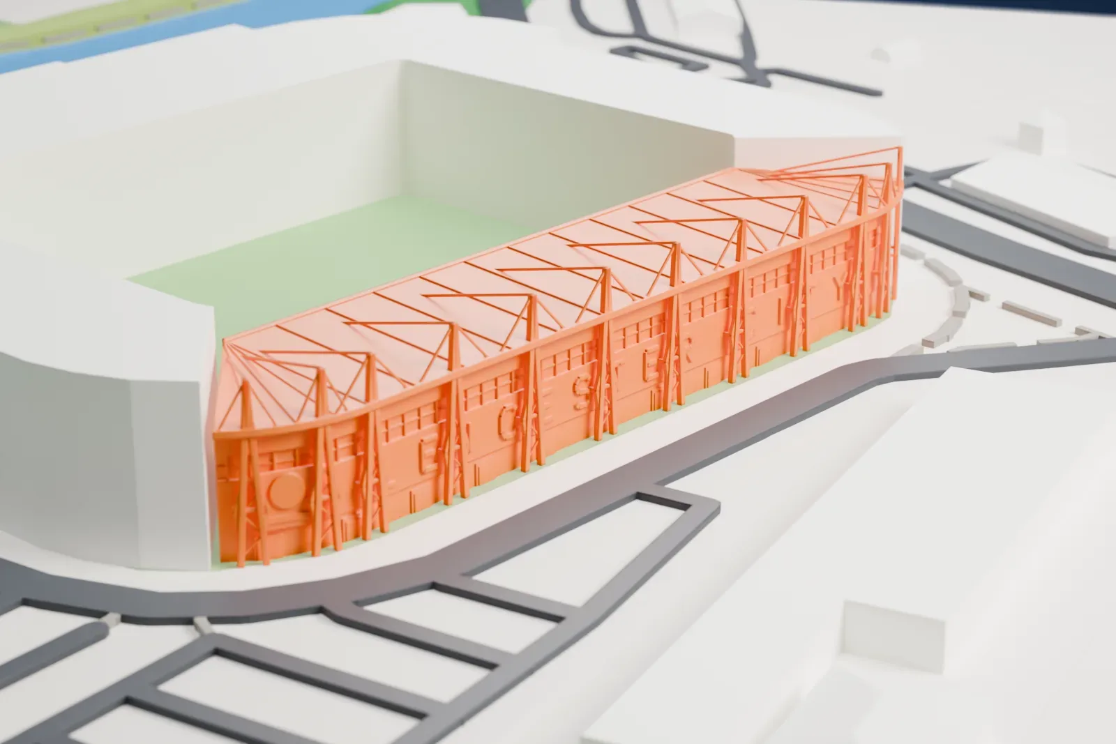 A white 3D print of the East Stand at King Power Stadium, one steep tier under a flat roof with a row of masts before the facade, among streets and buildings.