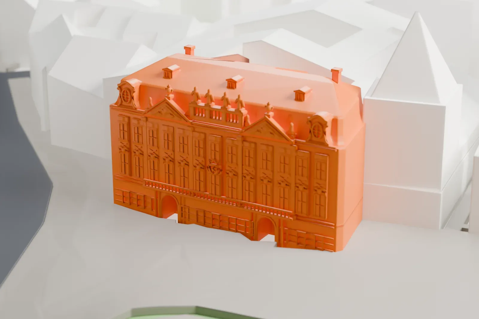 A white 3D print of the Kinský Palace on Old Town Square, among the surrounding buildings.