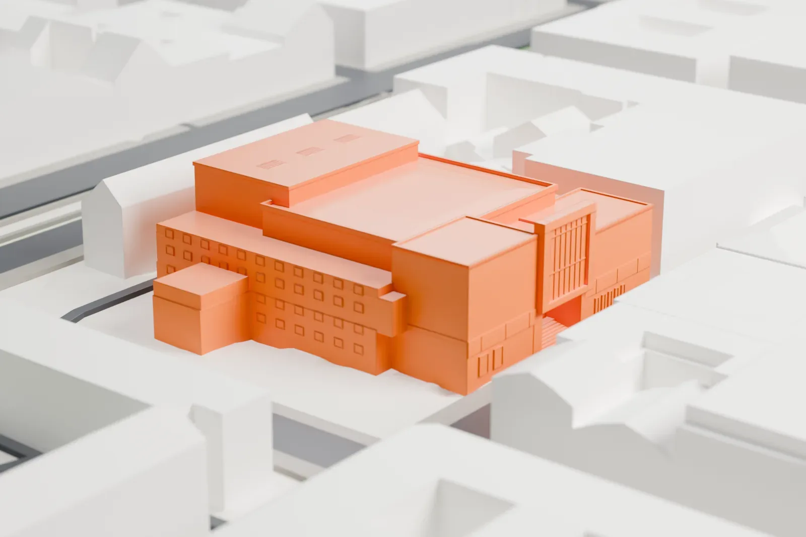 A white 3D print of the Komische Oper Berlin on Behrenstraße, with the theater facade and surrounding streets and buildings.