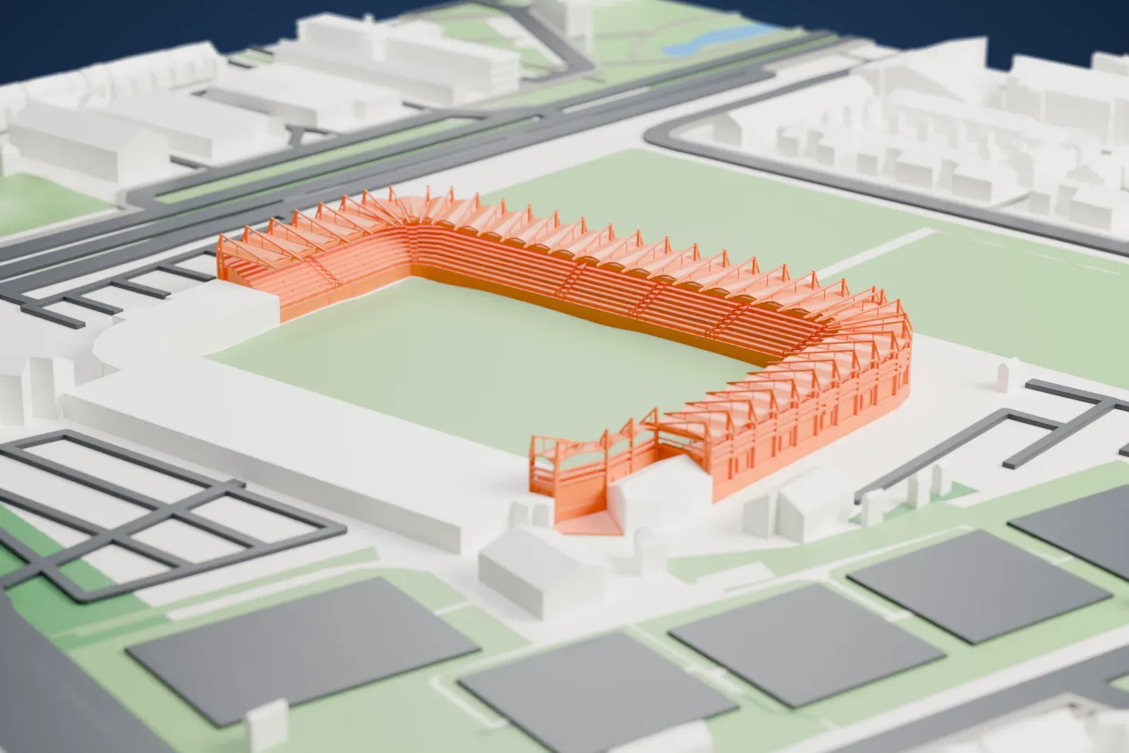 A white 3D print of Koning Willem II Stadion, a single-tier stand under a scalloped canopy with exposed triangular trusses, around an open field among the surrounding streets and buildings of Tilburg.