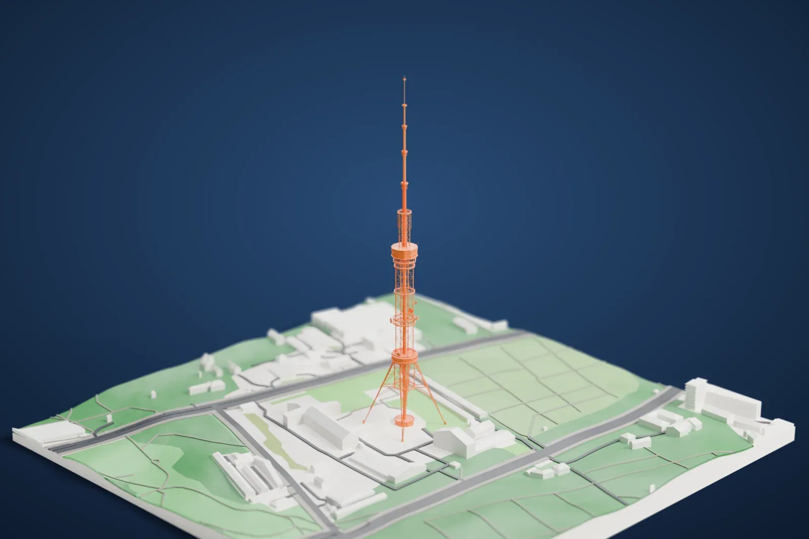 A white 3D print of the Kyiv TV Tower, a tall open lattice tower with two cabins and a slender stepped antenna, standing among surrounding city buildings.