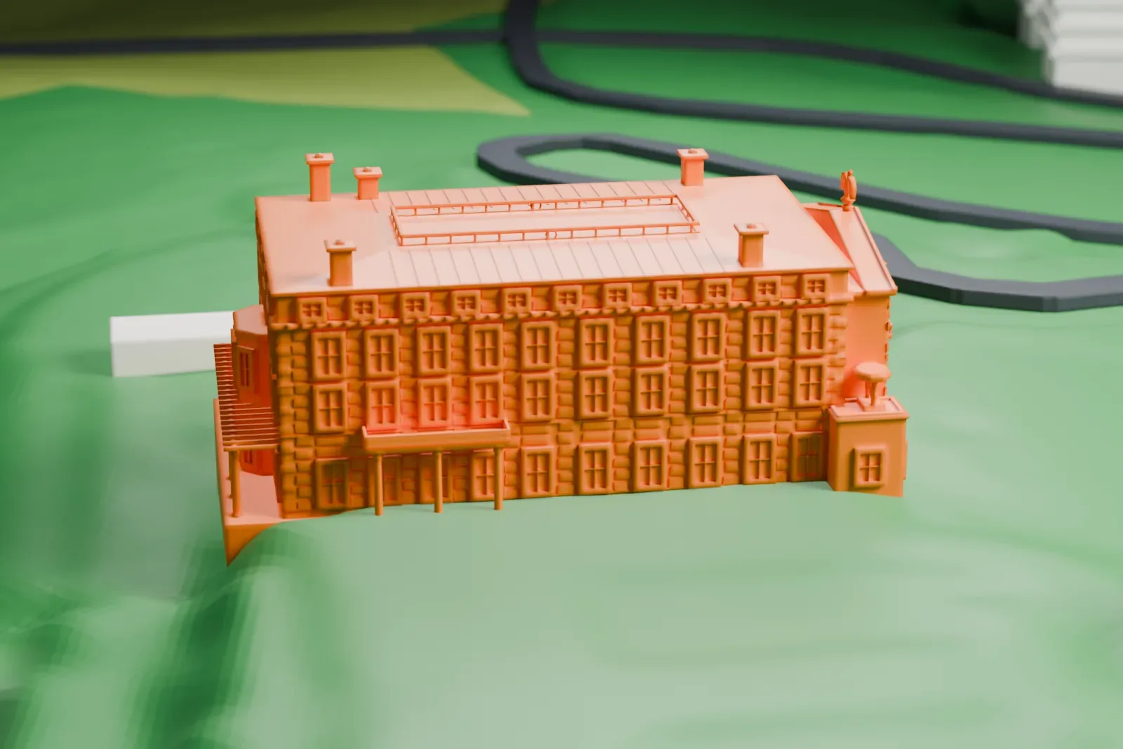 A white 3D print of Kykuit, a four-story mansion with columned porches and a gridded roof feature, set on green hillside grounds with a few small outbuildings.