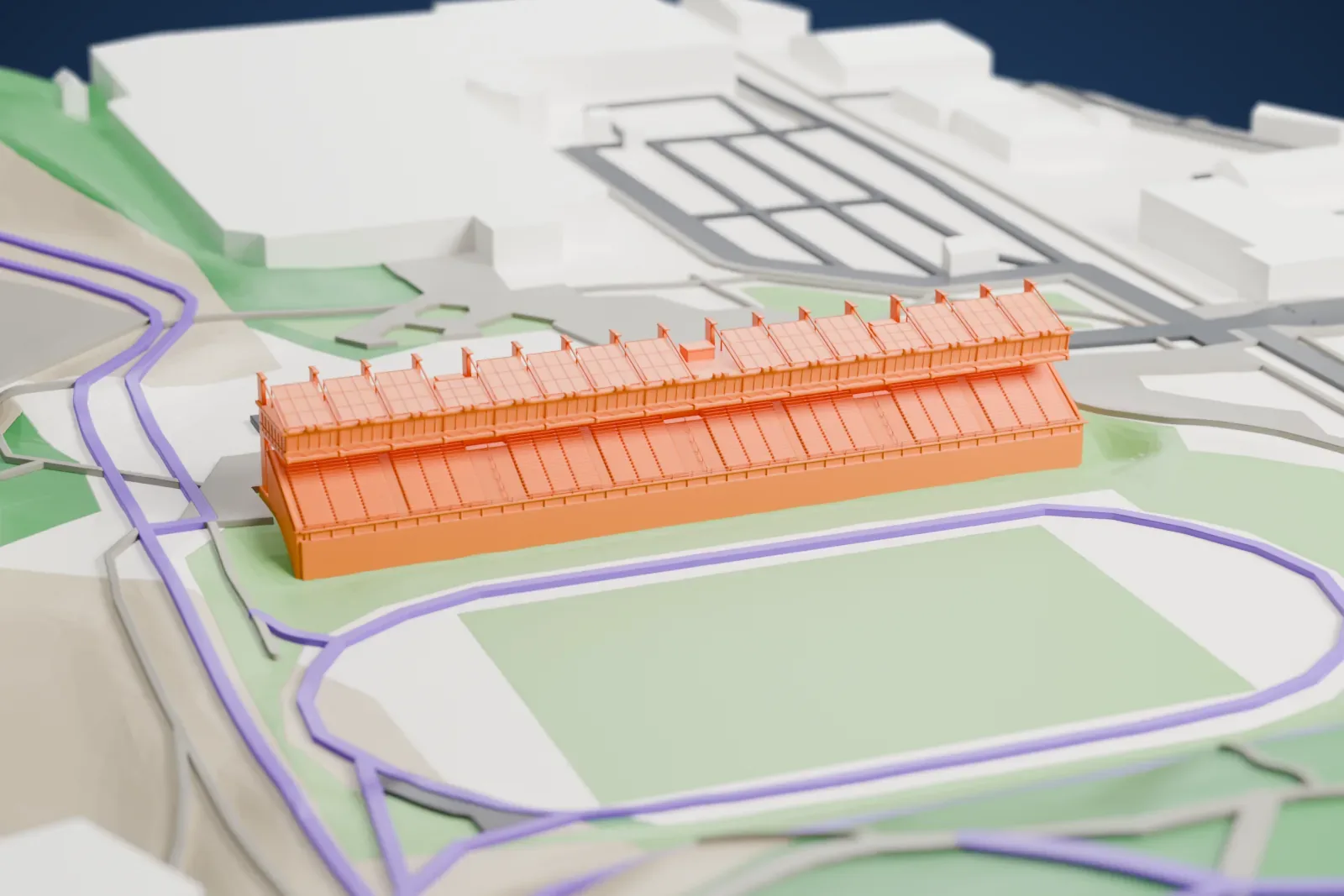 A white 3D print of Lahti Stadium's long grandstand beside an oval track area, with roads and open land around it.