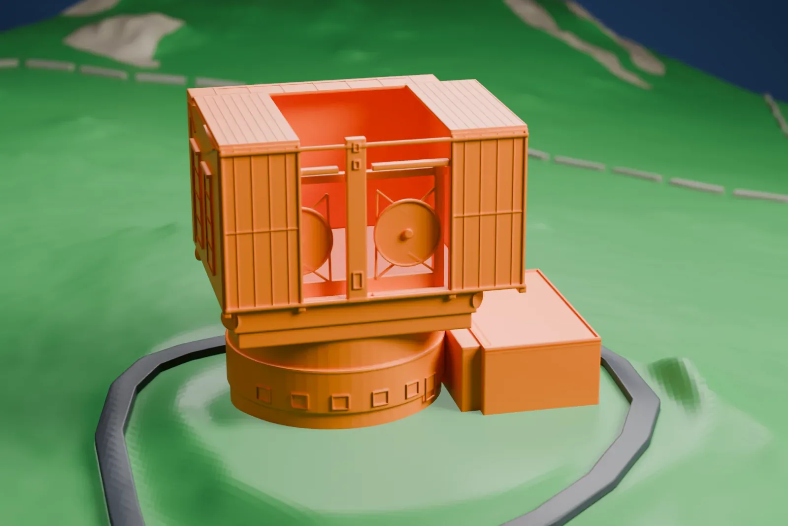 A white 3D print of the Large Binocular Telescope, a boxy enclosure on a round base, standing on a green hillside with a dark road looping around it.