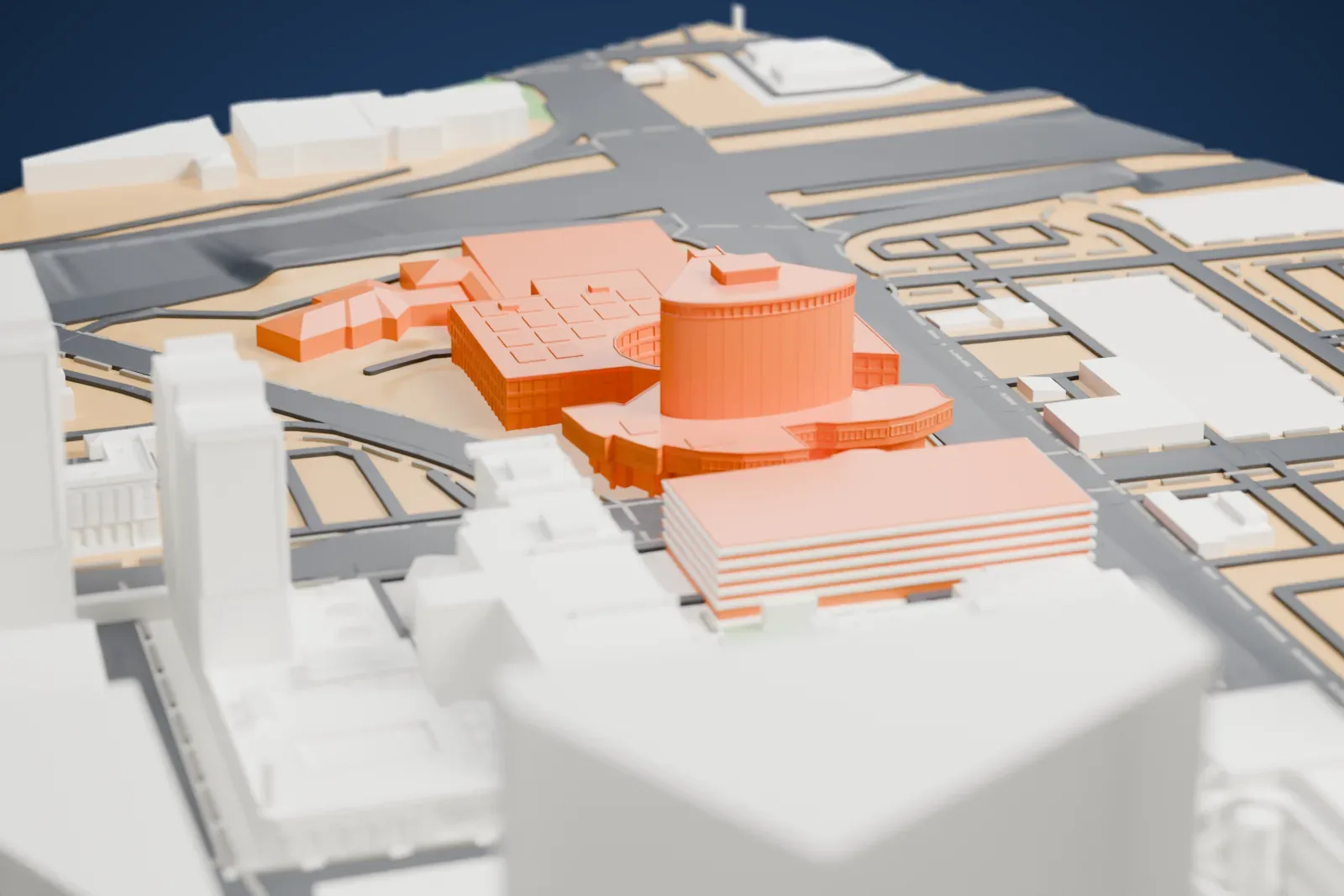 A white 3D print of Las Vegas City Hall, a curved central tower rising from a wide low building with a round courtyard and small rooftop panels, among downtown streets.