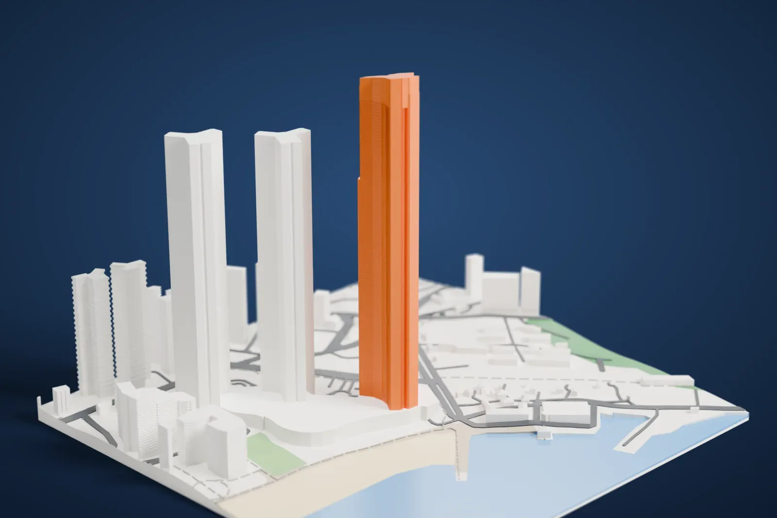 A white 3D print of the Haeundae LCT The Sharp landmark tower, a very tall slender tower with a notched crown, beside two similar towers, with a shoreline and water nearby.