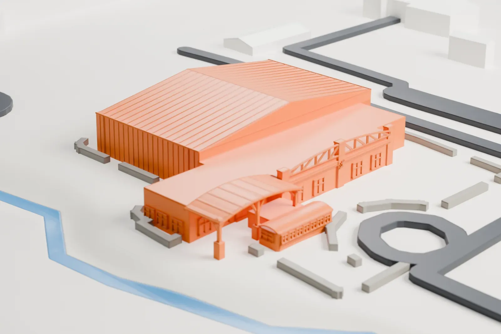 A white 3D print of the Liberty Aviation Museum hangars, a large ridged-roof hangar joined to a lower wing with an arched lattice roof, on open ground beside roads and a narrow stream.