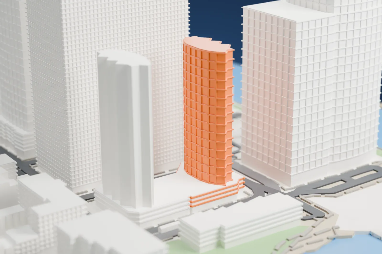 A white 3D print of Liberty Towers, two curved towers rising from a shared wide podium, with larger buildings and a street grid around them.