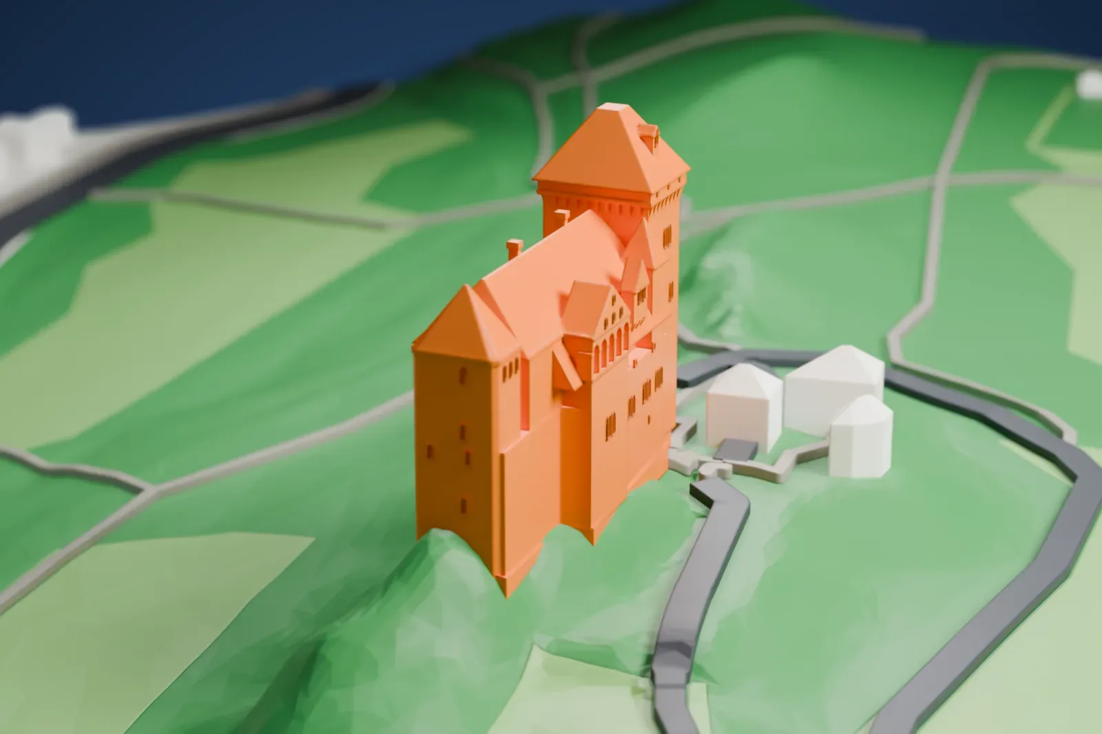 A white 3D print of Liechtenstein Castle among the surrounding streets and buildings.
