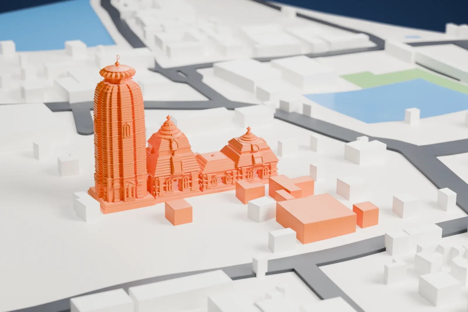 A white 3D print of Lingaraja Temple, a tall ribbed tower beside lower halls with stepped pyramidal roofs, surrounded by low buildings and streets.