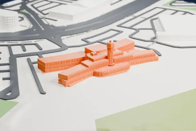 A white 3D print of the Liverpool Speke Art Deco terminal model in Liverpool, with the streets around it.