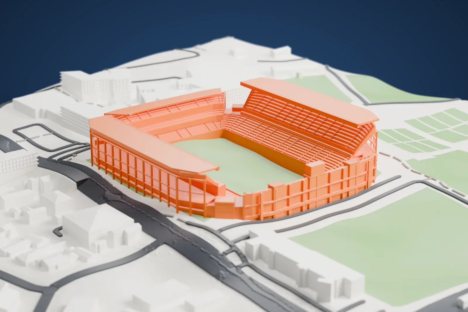 A white 3D print of Loftus Versfeld Stadium, a closed rectangular bowl with two tall roofed stands along the sides and a lower stand with a scoreboard box at one end, set among surrounding streets and buildings.
