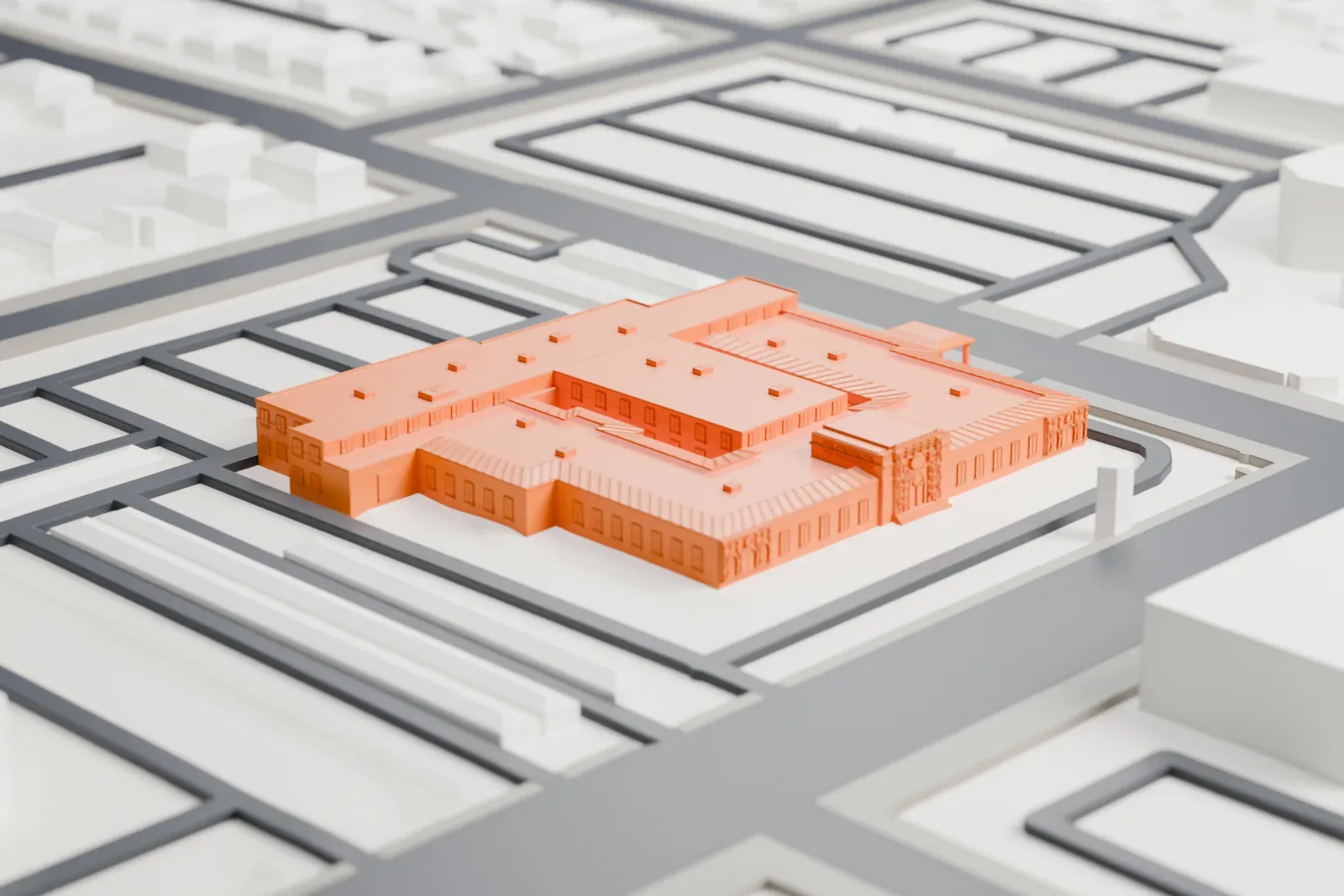 A white 3D print of the Lois Grunow Memorial Clinic, a low historic building among surrounding streets and buildings.