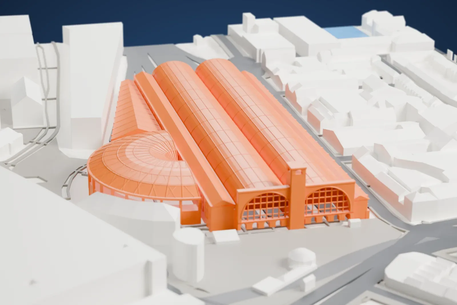 A white 3D print of London King's Cross railway station, a long low building among surrounding streets and buildings.