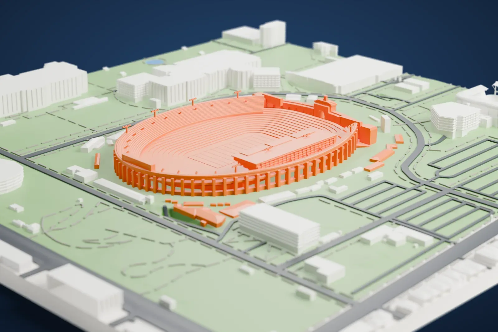 A white 3D print of the Los Angeles Memorial Coliseum, an oval stadium bowl with stepped tiers, an arched outer wall and an arched peristyle at one end, surrounded by park lawns, roads and large buildings.