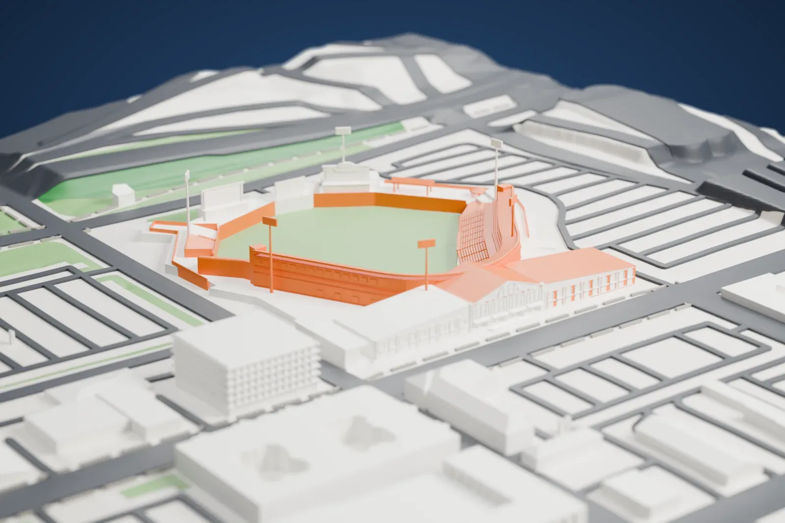 A white 3D print of Louisville Slugger Field, a baseball stadium with a green field, ringed by streets and low buildings.