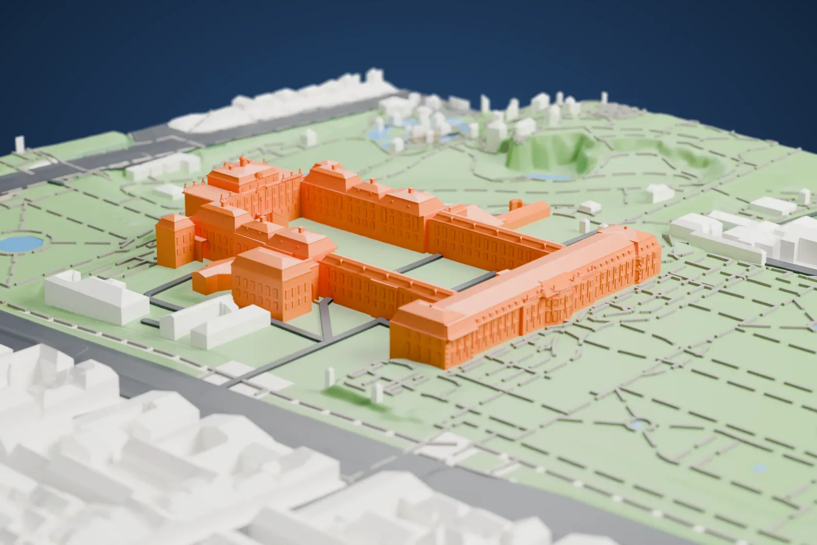 A white 3D print of Ludwigsburg Palace, long wings with rows of windows around a courtyard, set in green gardens with winding paths, small ponds and nearby streets.