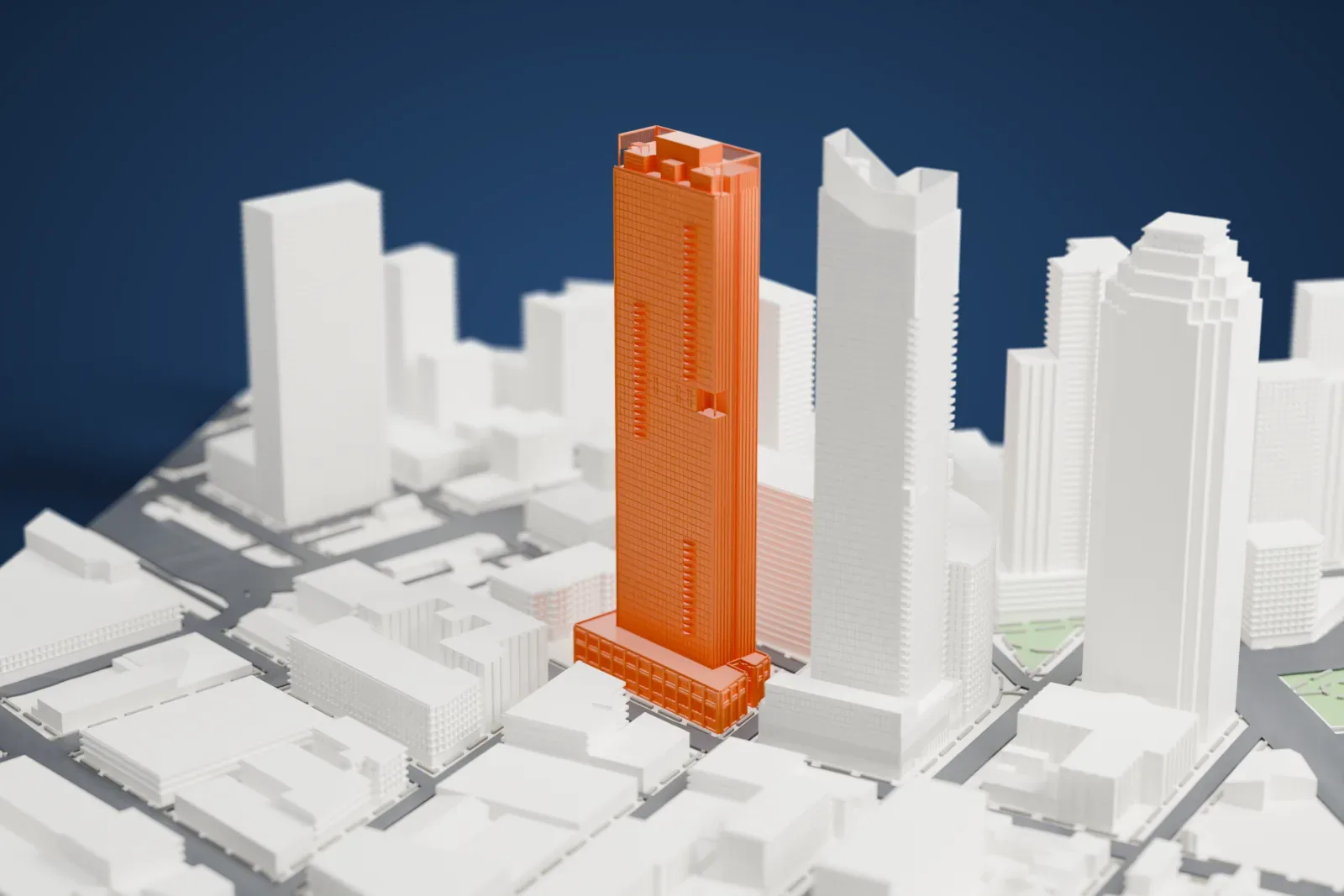 A white 3D print of Lumen, a slender tower rising from a wide base, standing among other tall buildings and lower blocks.