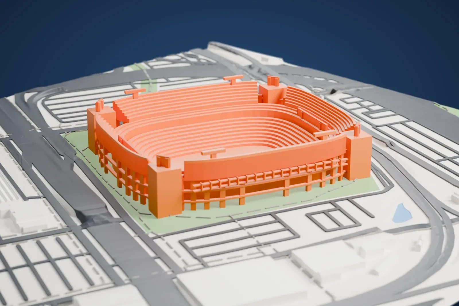 A white 3D print of M&T Bank Stadium, an open oval bowl of curved seating rows with tall corner towers, set among streets and low buildings.