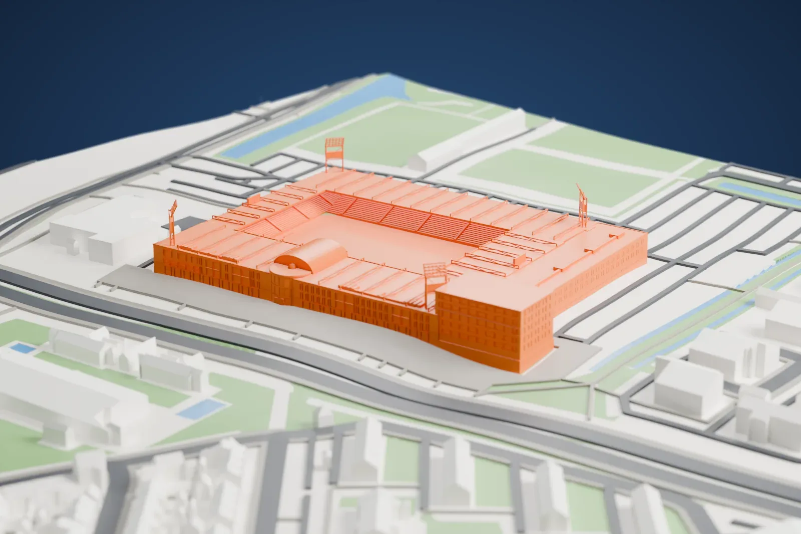 A white 3D print of MAC3PARK Stadion, a stadium with roofed stands on several sides around a pitch, among the surrounding streets and buildings.