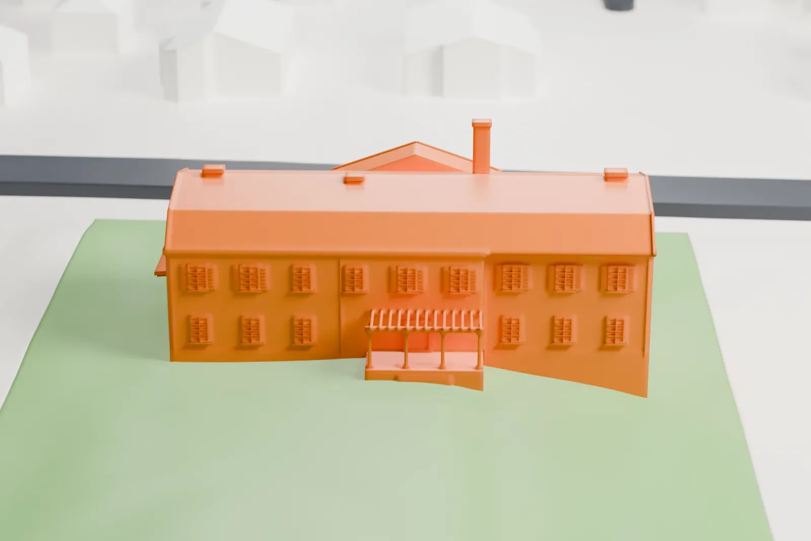 A white 3D print of Macculloch Hall, a large house on a green lawn, surrounded by houses and a grid of streets.