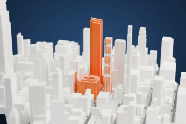 A white 3D print of the Madison House model in New York, with the streets around it.