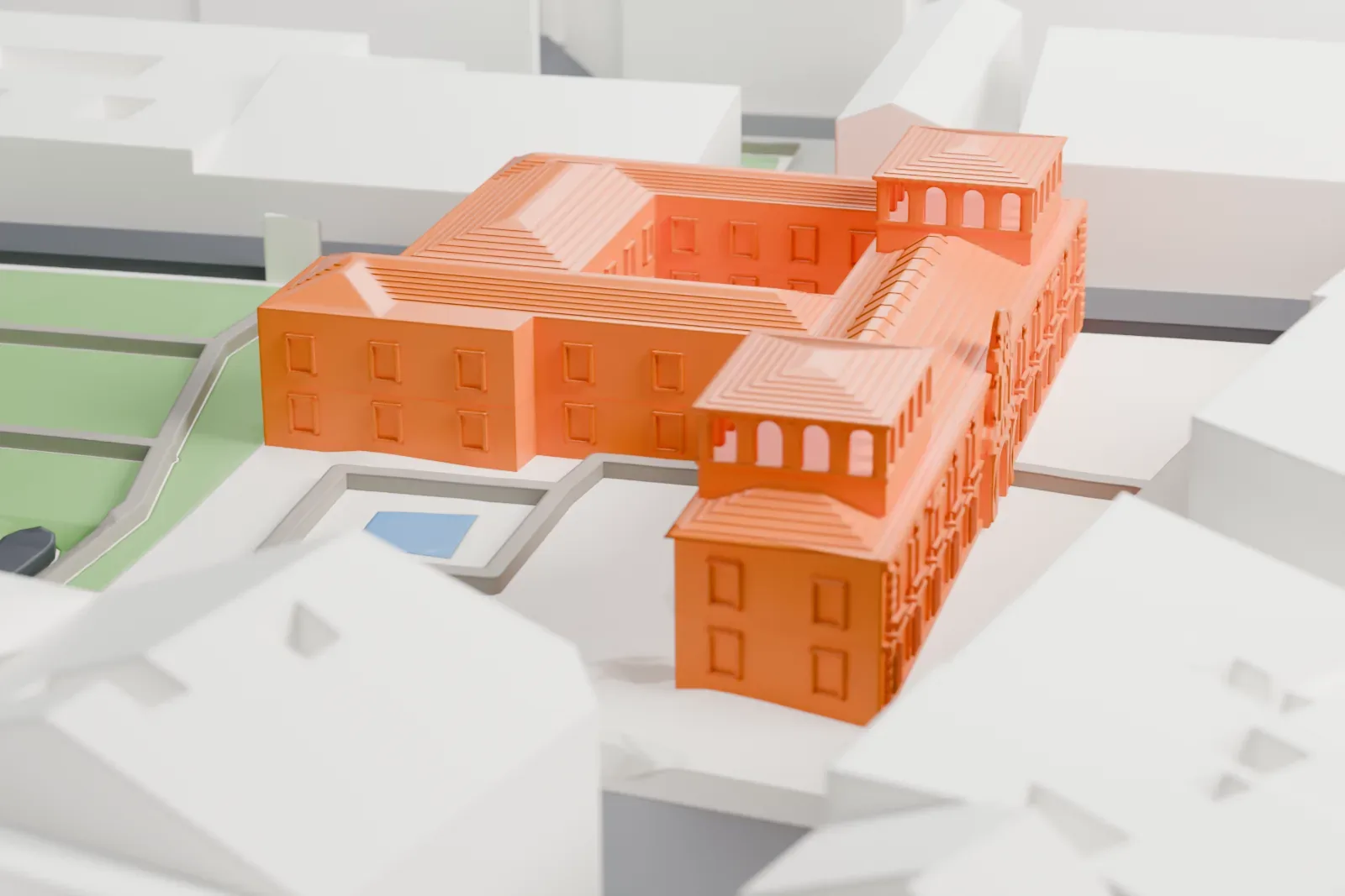 A white 3D print of the Madrid History Museum, a low historic building, among the surrounding streets and buildings of downtown Madrid.