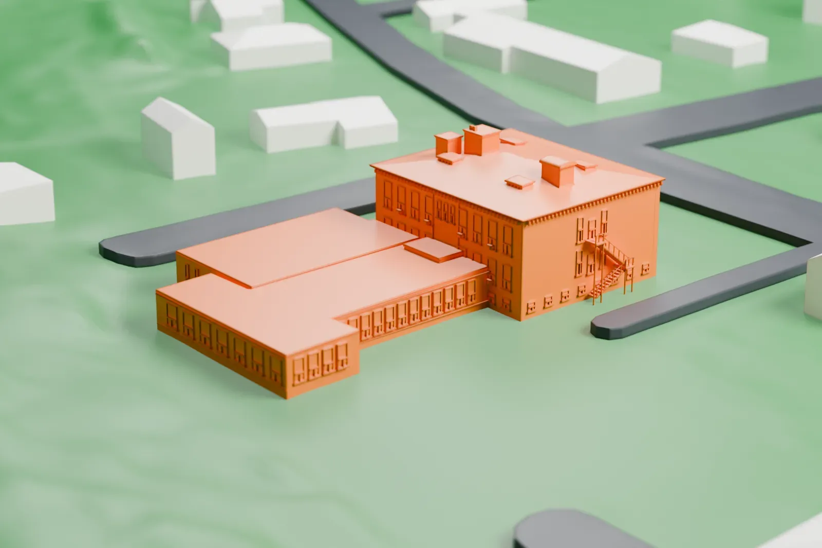 A white 3D print of a two-story school building with a long low wing, among houses and green lawns.
